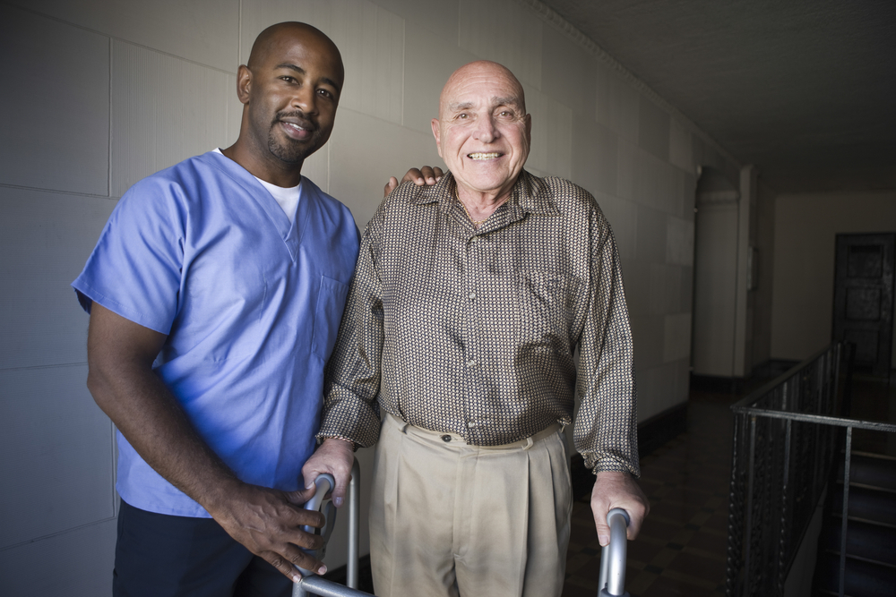 Male healthcare worker with elderly man