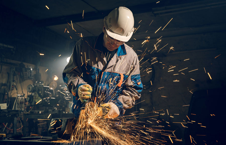 A welder produces sparks as he does his work