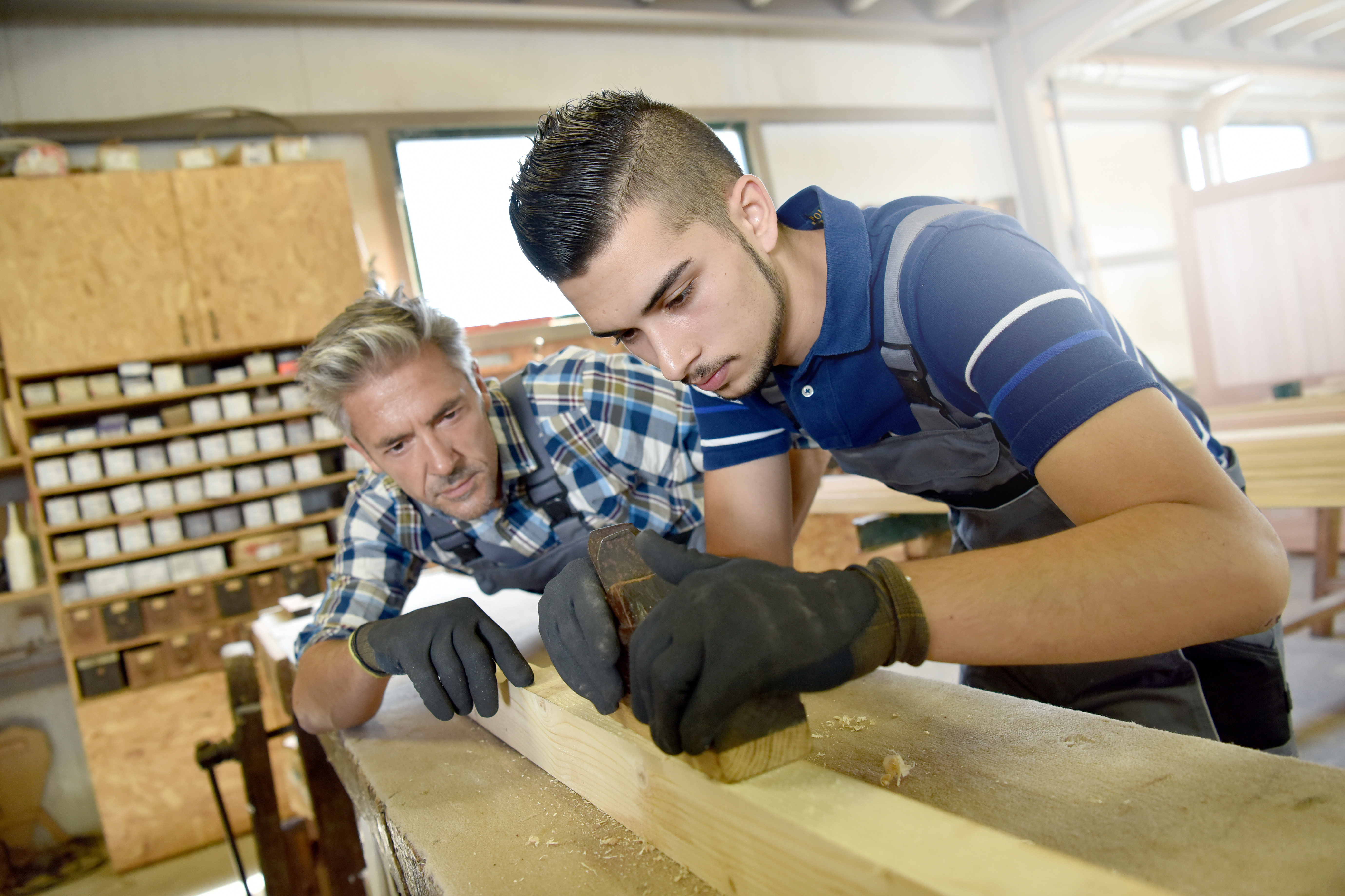 Through an apprenticeship, you learn a trade while earning a paycheck. (Credit: goodluz/Shutterstock)