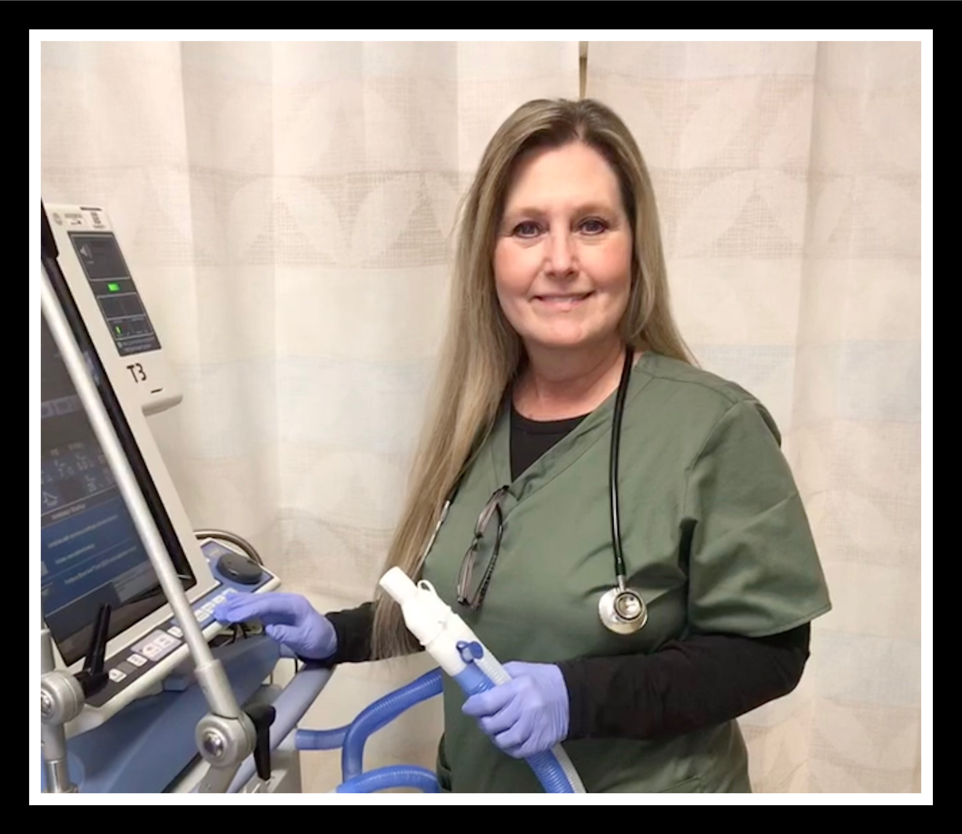 Respiratory therapist Kimby Powell with a ventilator
