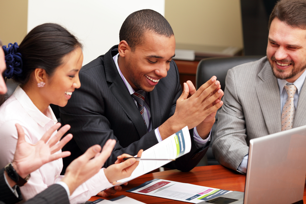 Multi ethnic business team interacting at a meeting