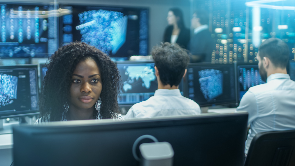 Female IT worker works on a computer, representative of information tech jobs in Baltimore