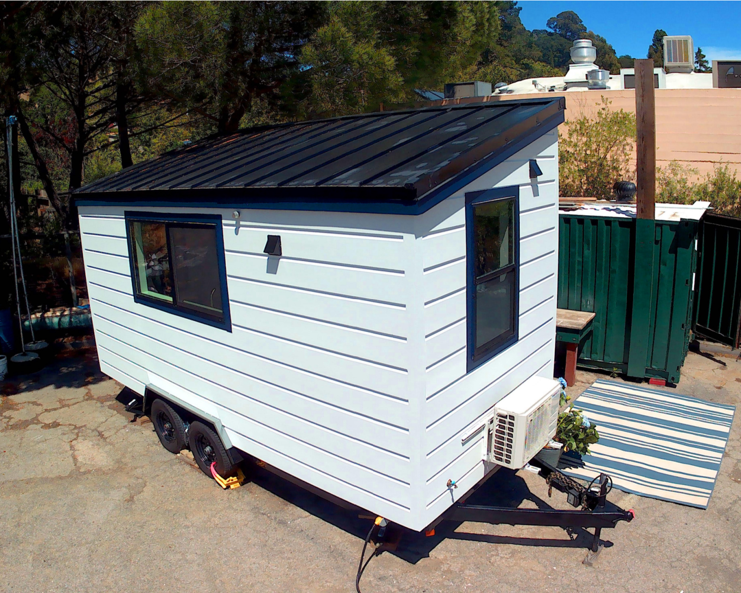 exterior of tiny home built by Big Skills Tiny Home showing wheels