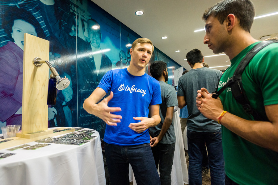 Students from University of Texas talk about their startup ideas at a trade conference in Austin, Texas.