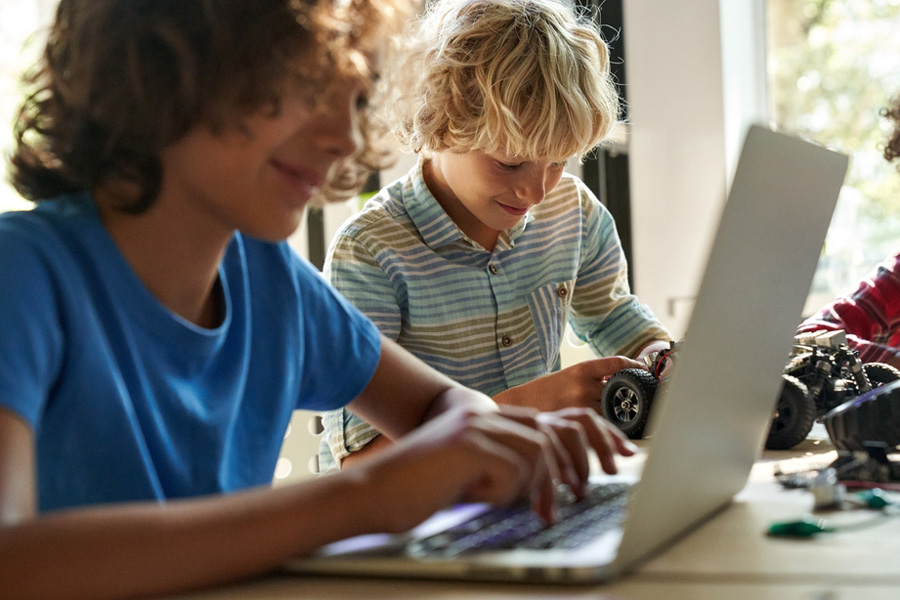 Diverse children learn programming using computers and by constructing a small car