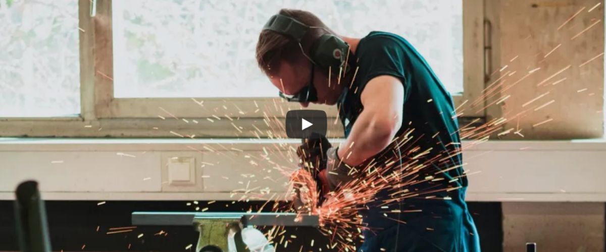 man in safety glasses welding; learn how SkillPointe works