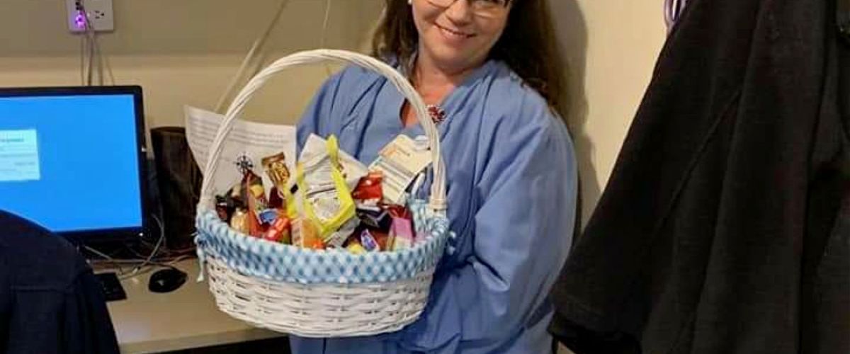 Cardiovascular technologist Shaun Foust holds a thank-you basket sent to the team for working during the COVID-9 pandemic