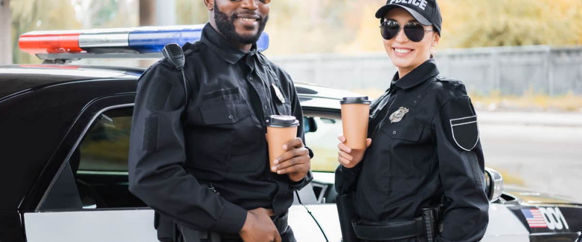 two young police officers take a coffee break, story about how to become a police officer