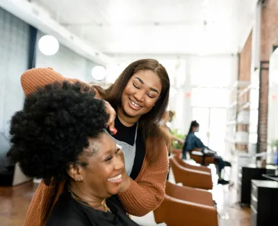 Hairdresser with client in chair