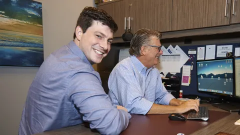 IT specialist Andrew Sonon with client John Whitehall 