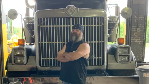 David Pannell, truck driver from Pennsylvania, in front of his rig