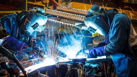 Two welders learn how to weld.