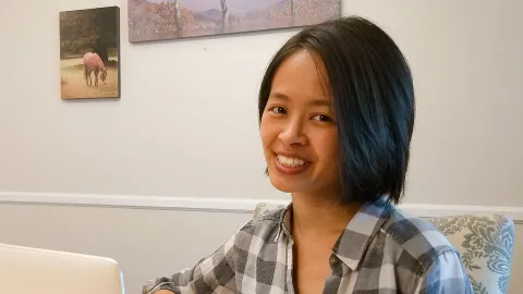 Pauline Lu, graphic designer, working on her computer
