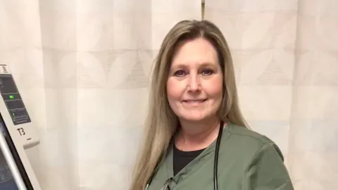 Respiratory therapist Kimby Powell teaches how a breathing tool works