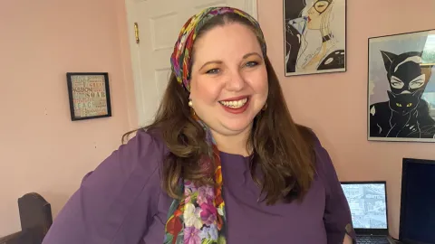 Mia Luchins, a training and development specialist, smiles for the camera