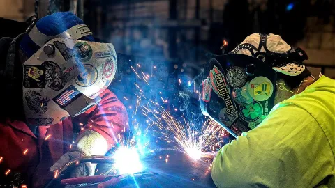 Todd Clements, steamfitter, works on a piping system