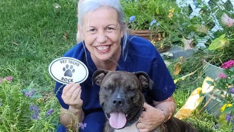 Vet tech Allison Milstone with her dog, Reagan