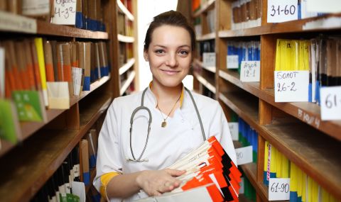 A medical records technician helps keep track of patient data