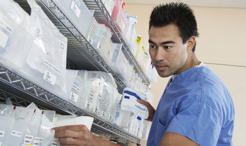 A pharmacy technician checks prescriptions