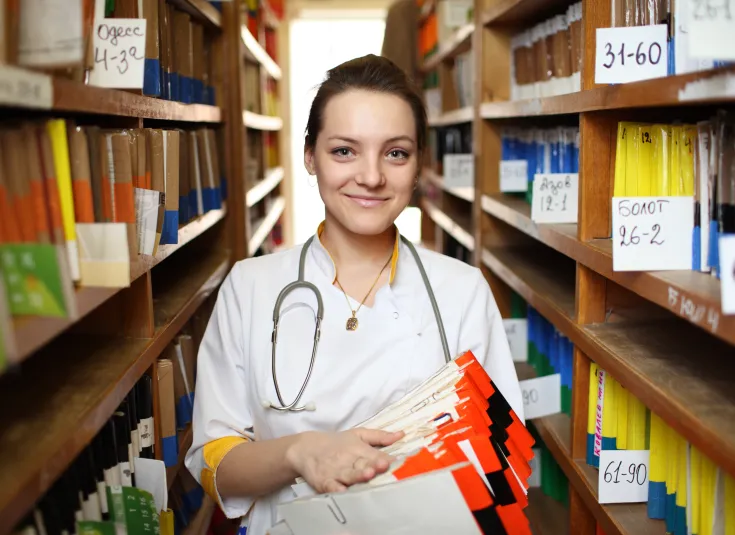 A medical records technician helps keep track of patient data