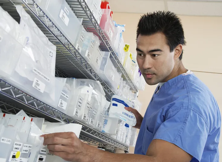 A pharmacy technician checks prescriptions
