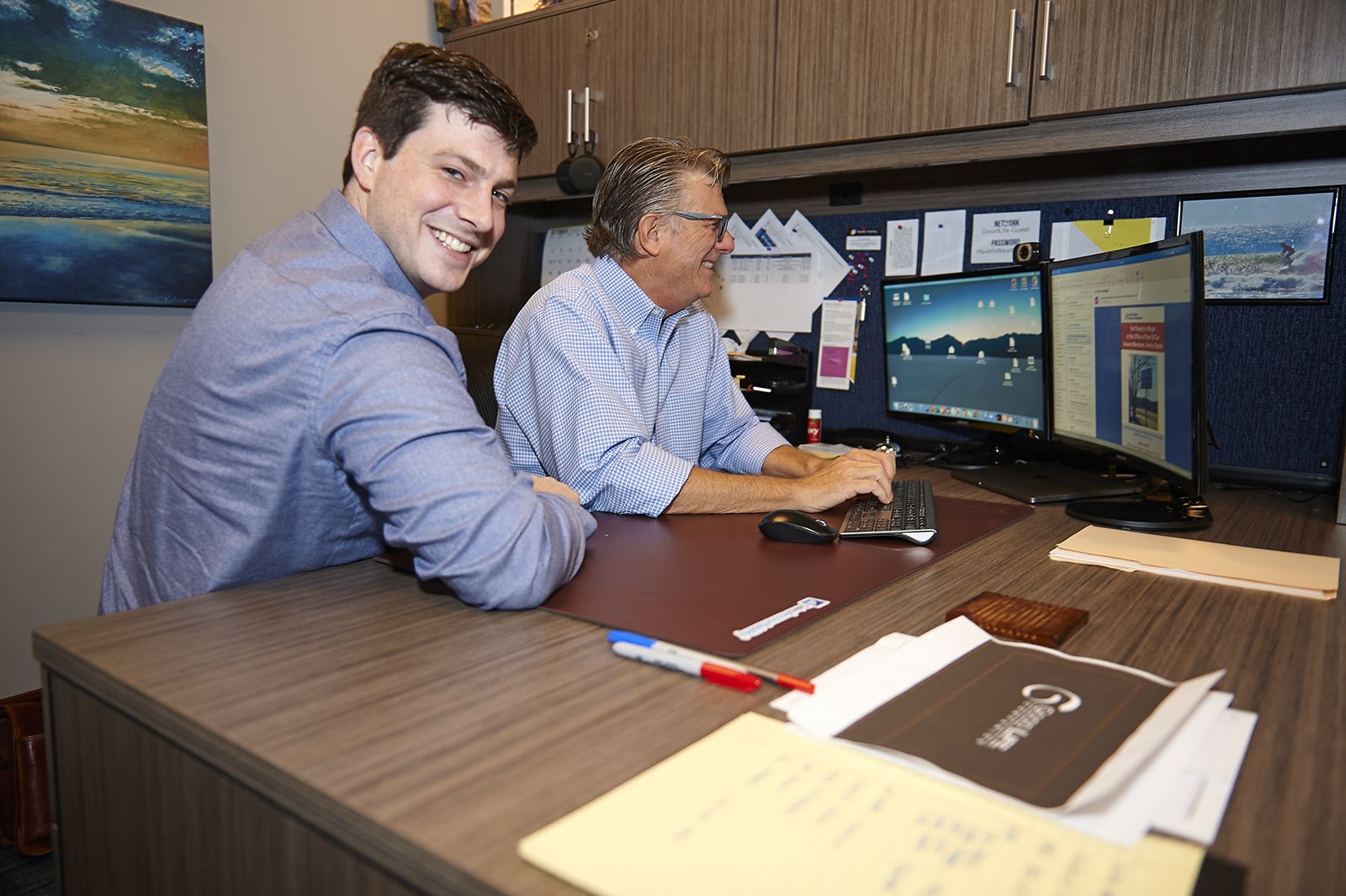 IT specialist Andrew Sonon works with client John Whitehall 