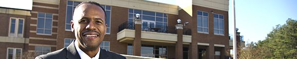 Administrator in front of campus building at Central Georgia Technical College in Warner Robins GA