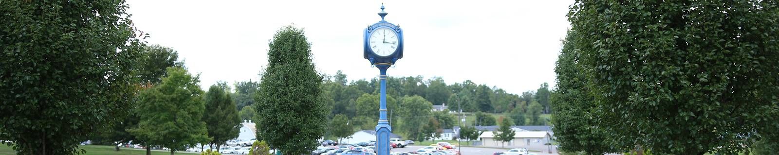 A photo of the blue clocktower on the West Virginia University at Parkersburg campus.