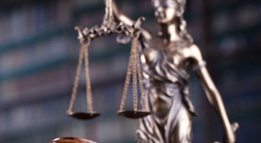 Scales of justice and a judge's gavel, symbolizing a paralegal's work