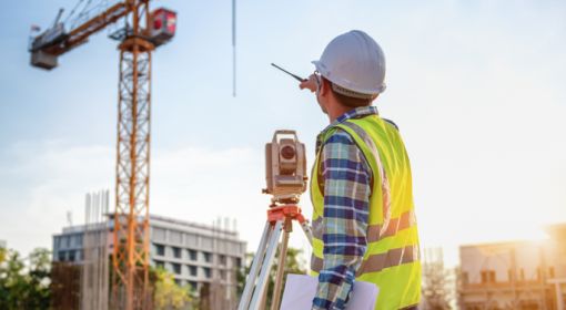 surveying and mapping technician on a job site