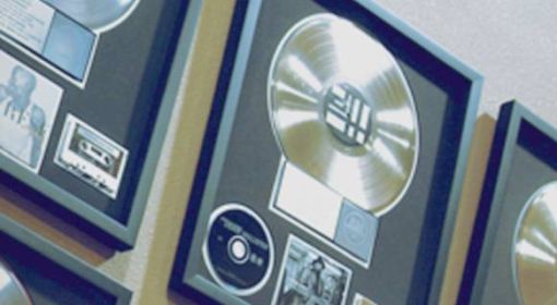 Framed platinum records hung on the wall.