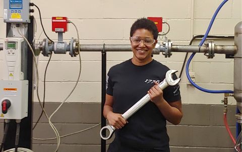 Electrical and electronics engineering technician Tracy Wilson with a wrench