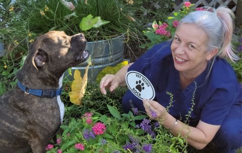 Veterinary tech Allison Milstone with her dog, Reagan