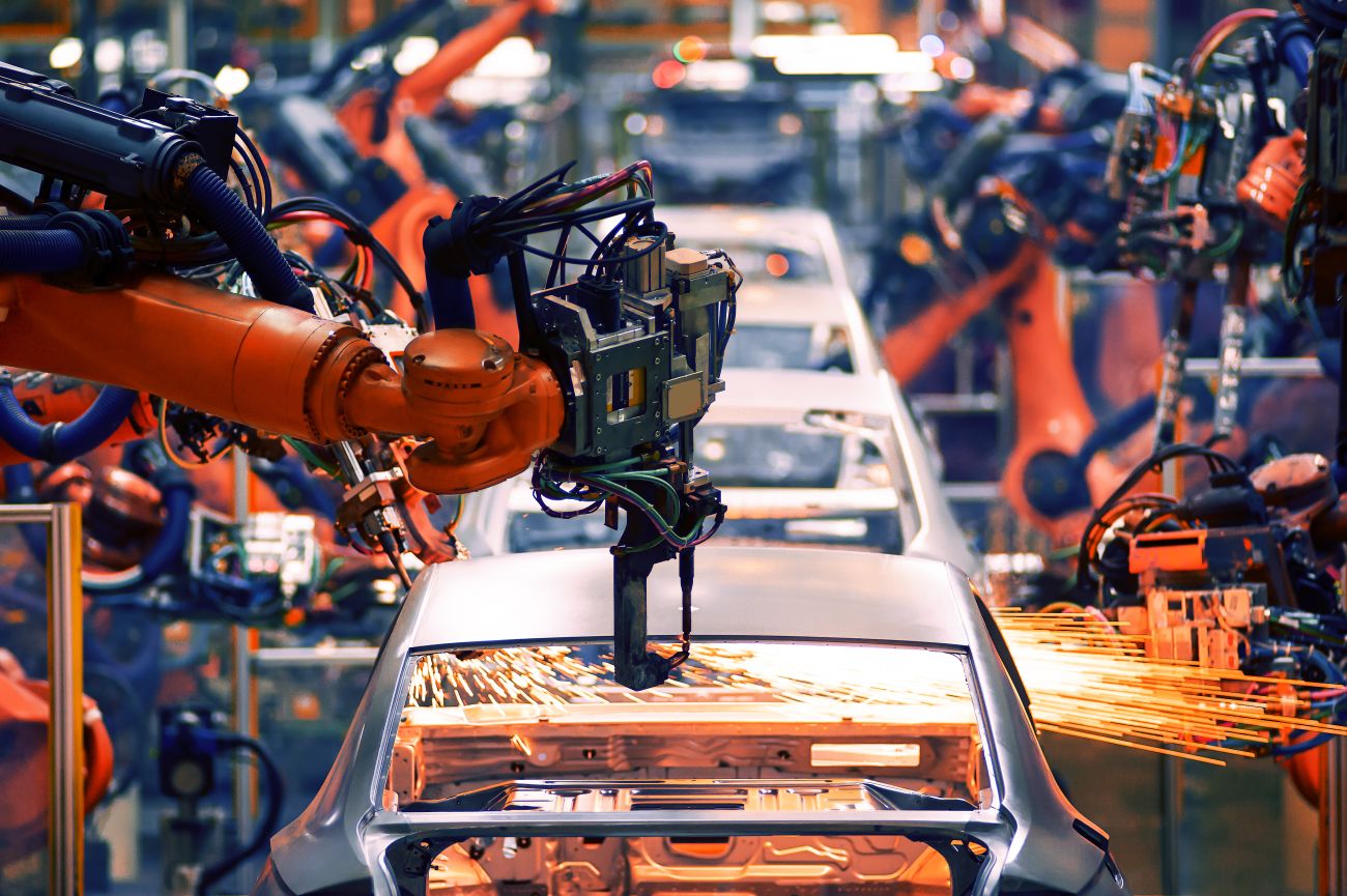 Electromechanical technicians maintain equipment like the robotic arm in a car factory