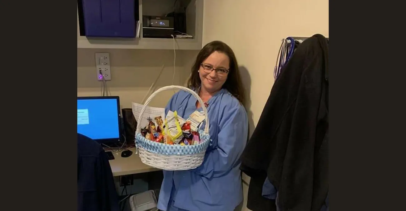 Cardiovascular technologist Shaun Foust holds a thank-you basket sent to the team for working during the COVID-9 pandemic