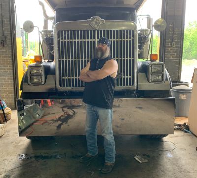 David Pannell, truck driver from Pennsylvania, in front of his rig