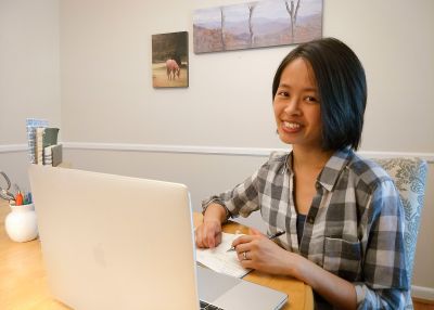Pauline Lu, graphic designer, working on her computer