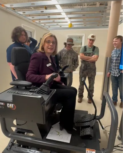 Dr. Rebecca Corbin tries the Caterpillar simulation