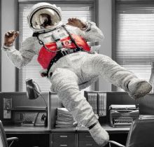 Astronaut floating in an office with General Assembly logo on space suit