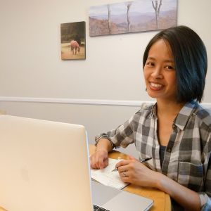 Graphic designer Pauline Lu works at her computer