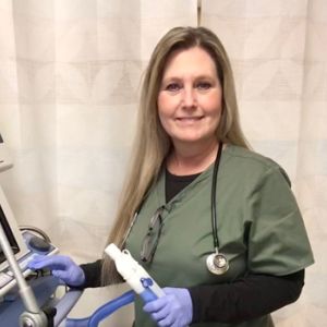 Respiratory therapist Kimby Powell holding a ventilator tube