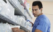 A pharmacy technician checks prescriptions