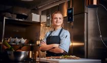 Young female chef takes a break from food prep 